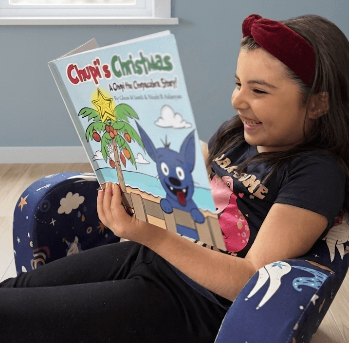 A young reader with Chupi's Christmas